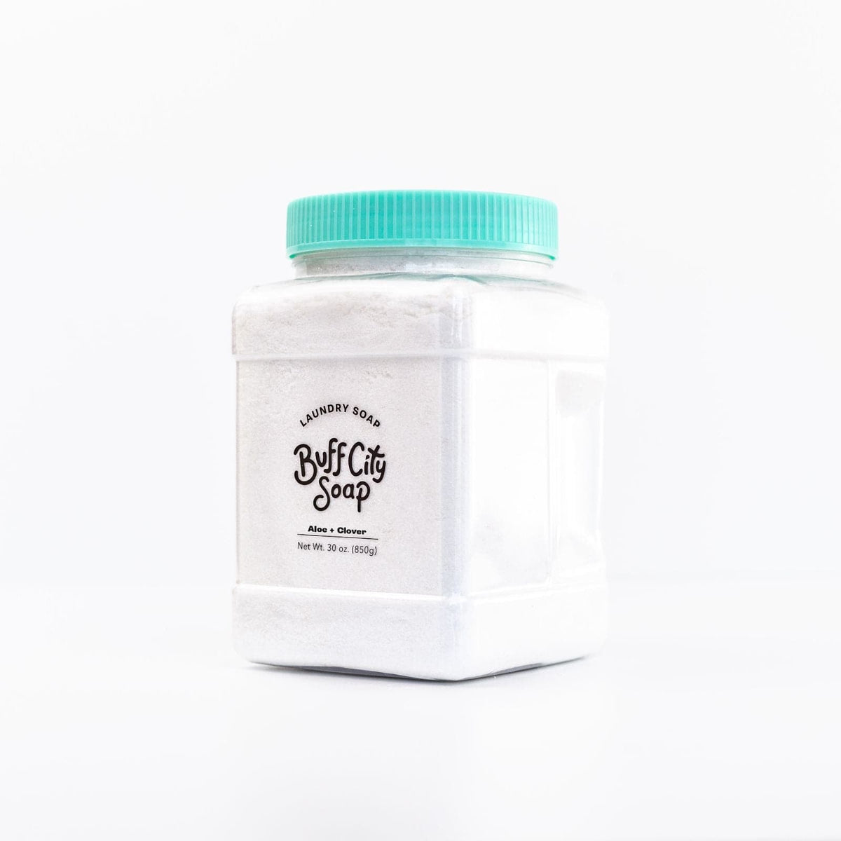 Aloe + Clover Laundry Soap in container with teal lid angled against white background